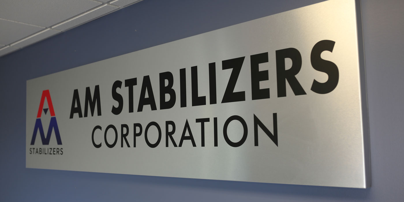 A sign that reads 'AM Stabilizers Corporation'