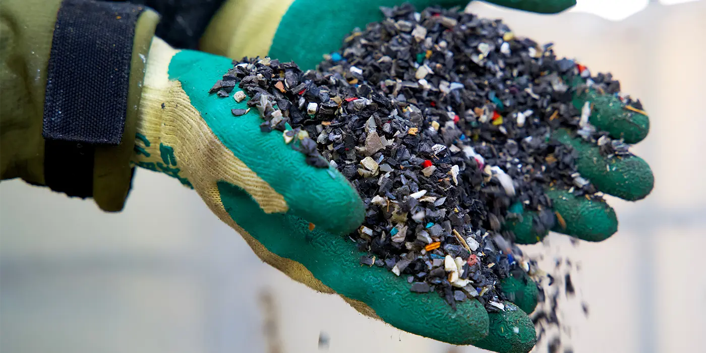 During the process of recycling plastics, the material is shredded into small pieces that can be further refined.