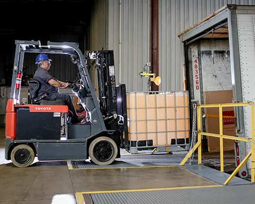 A trailer being loaded with a forklift